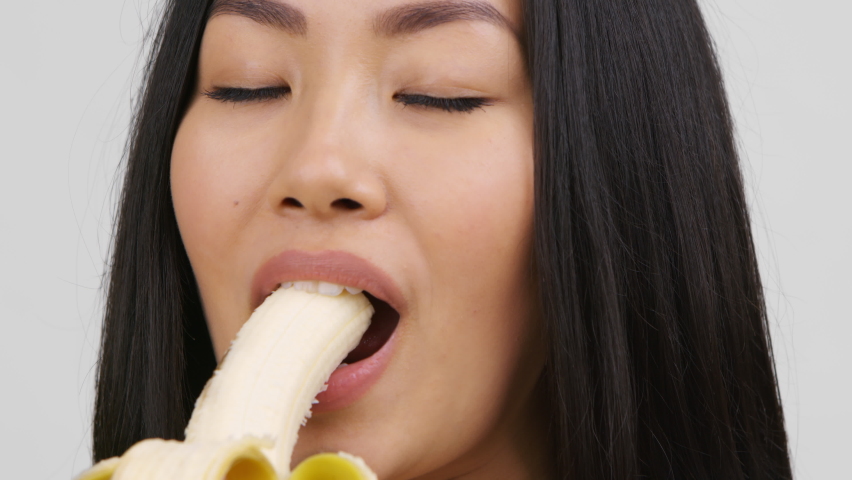 Gorgeous Japanese hotty sexily eating a banana